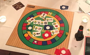 “Capitalism is So Much Easier!” Learning Savings through Playing a Board Game